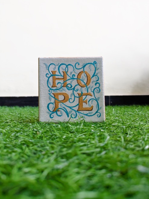 Small HOPE canvas standing on grass