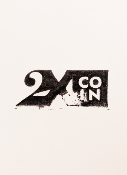 2XCOIN stamp on cream paper