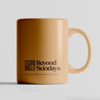 Tan mug printed with the Beyond Sundays mark