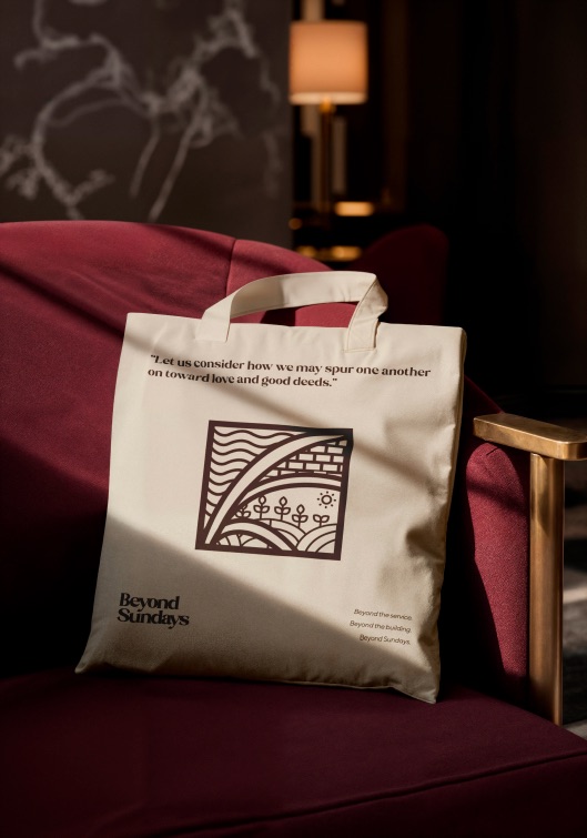 Beyond Sundays tote on a burgundy chair