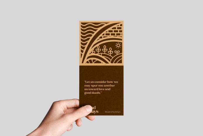Hand holding a brown Beyond Sundays card with a Hebrews quote