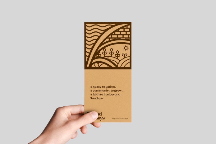 Hand holding a kraft Beyond Sundays card