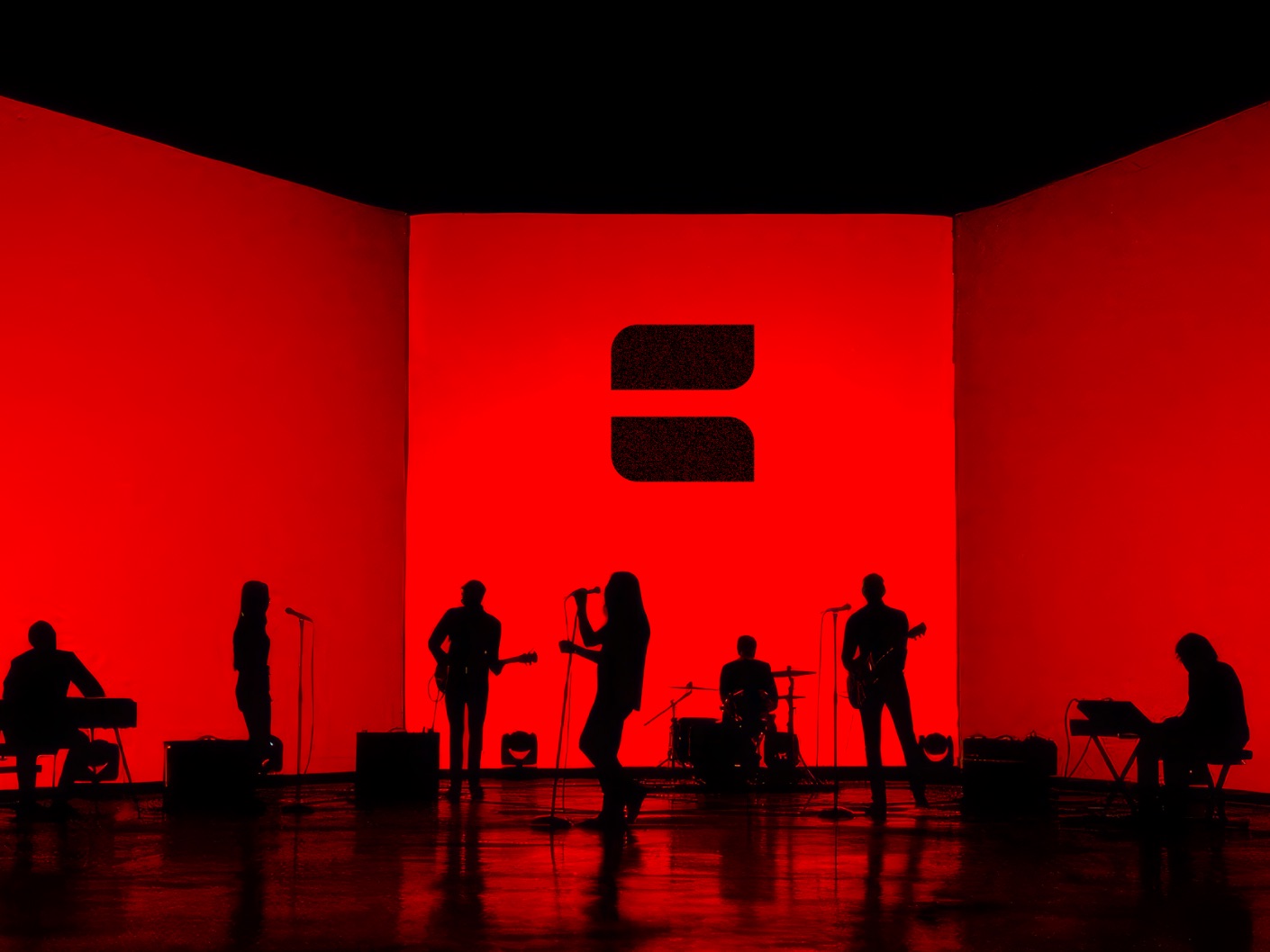 Hicall band on a red stage